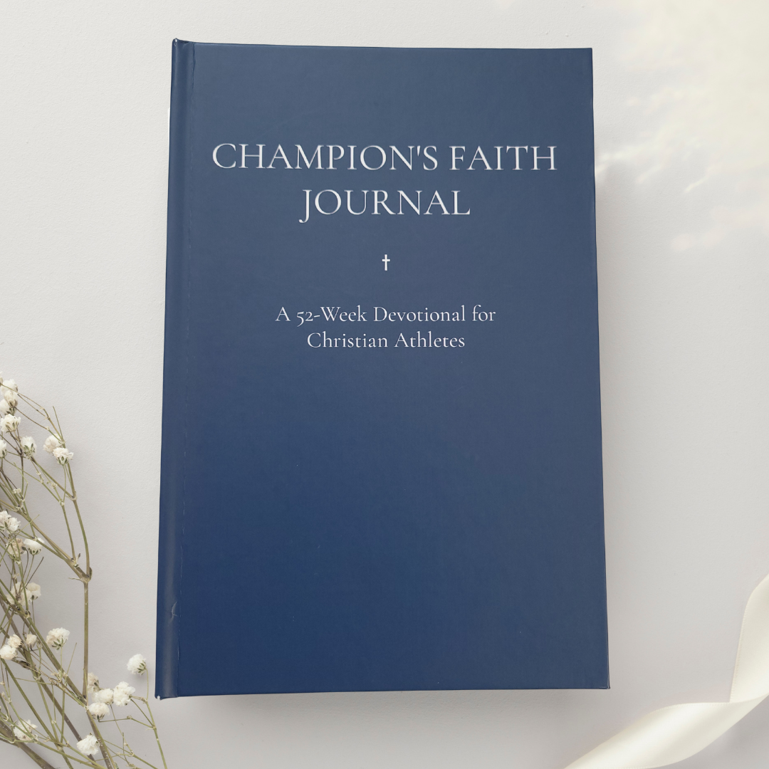 Blue journal titled 'Champion's Faith Journal' on a white background with decorative elements.